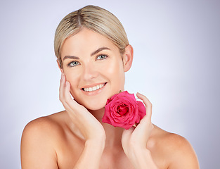 Image showing Beauty, studio portrait or happy woman with flower for facial cleaning, organic skincare or natural cosmetics. Face, sustainable dermatology or makeup person with self love rose on white background