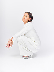 Image showing Business, suit and portrait of a woman on a studio background with confidence and class. Stylish, fashion and a young Asian model or girl in clothes for work isolated on a backdrop for corporate