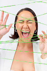 Image showing Makeup, fashion and strings with woman screaming in studio for creative, art and cosmetics. Abstract, cotton and texture with face of model on white background for designer, shouting and textile