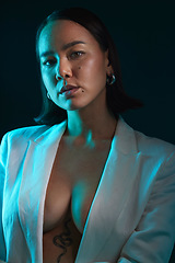 Image showing Sexy, portrait and fashion with a woman on a studio background for a luxury aesthetic. Creative, young and an Asian model or girl with a suit or vintage and isolated on a dark or black backdrop