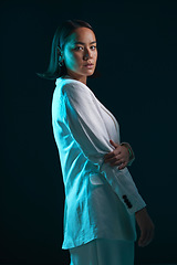 Image showing Professional, portrait and woman in suit on a dark background for a corporate aesthetic. Serious, fashion and an Asian model or girl in clothes for work and isolated on a black backdrop for business