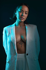 Image showing Dark, portrait and fashion with a woman on a studio background for a luxury aesthetic. Creative, young and an Asian model or sexy girl with a suit or vintage and isolated on a black backdrop