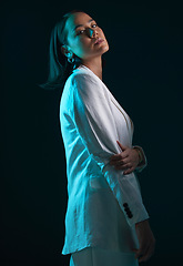 Image showing Fashion, portrait and a woman in a suit on a dark background for a corporate aesthetic. Serious, stylish and an Asian model or girl in clothes for work and isolated on a black backdrop for business