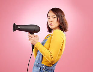 Image showing Hairdryer, salon and beauty with portrait of woman in studio for hairdresser, hair care and cosmetic. Shampoo, spa and hairstyle with face of asian person on pink background for product and treatment