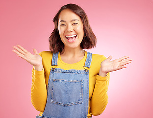 Image showing Happy, celebration and yes with portrait of woman in studio for party, winner and motivation. Wow, freedom and prize with face of person cheering in pink background for success, bonus and excited