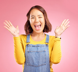 Image showing Happy, celebration and surprise with portrait of woman in studio for party, winner and motivation. Wow, freedom and prize with face of person cheering in pink background for yes, bonus and excited