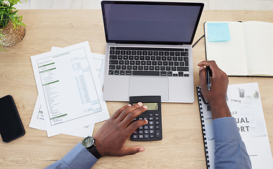 Image showing Hands, writing and finance with calculator, desk or budget for investing, tax or saving by blank laptop in office. Financial advisor, pc and mockup space on screen, income and expenses with banking