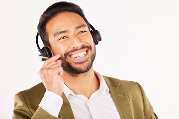 Image showing Call center, asian man and smile in studio for customer service, sales advisory and contact us on white background. Face of CRM consultant, IT support or communication of FAQ telemarketing questions