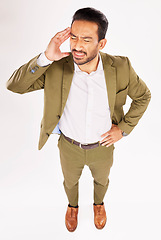 Image showing Business stress, asian man and headache in studio for fail, debt or stock market crash from above. Male trader, burnout and bankruptcy problem of financial crisis, pain or mistake on white background