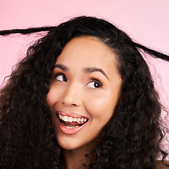 Image showing Beauty, curly hair and smile with face of woman in studio for cosmetics, textures and salon treatment. Shampoo, skincare and hairstyle with model on pink background for self care, facial and glow