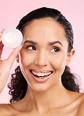 Image showing Skincare, happy and woman with cream jar in studio isolated on a pink background. Smile, beauty and natural model with moisturizer container, sunscreen cosmetic and dermatology product for wellness