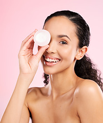Image showing Face, skincare and woman smile with cream container in studio isolated on a pink background. Portrait, beauty and happy model with moisturizer, sunscreen cosmetic or dermatology product for wellness
