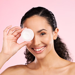 Image showing Face, skincare and happy woman with cream container in studio isolated on a pink background. Portrait, beauty and model smile with moisturizer, sunscreen cosmetic or dermatology product for wellness