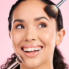 Image showing Product, makeup and brush with face of woman in studio for foundation, cosmetics and facial. Skincare, health and self care with female model on pink background for dermatology, glow and beauty