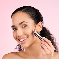 Image showing Smile, makeup and brush with portrait of woman in studio for foundation, cosmetics and facial. Skincare, health and self care with female model on pink background for dermatology, beauty and product