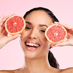 Image showing Face, grapefruit and beauty portrait of a woman with skin care, dermatology and natural glow. Happy young female aesthetic model with fruit for vitamin c, cosmetics or diet nutrition for detox