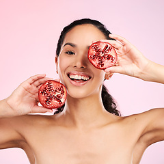 Image showing Woman, skincare portrait and pomegranate for beauty, natural cosmetics and facial product or vitamin c benefits. Face of person, red fruits and eye dermatology or skin care on pink, studio background