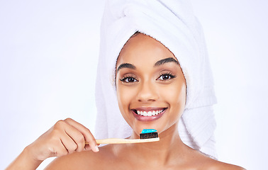 Image showing Toothbrush, dental care and portrait of a woman in a studio for a health and wellness routine. Smile, oral hygiene and headshot of young female model brushing teeth isolated by white background.