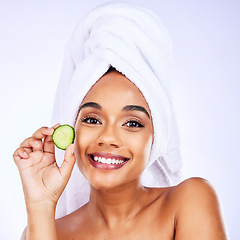 Image showing Skincare, cucumber and portrait of Indian woman in studio happy with detox, wellness or hydration treatment on grey background. Fruit, beauty and face of female smile for natural, vegan or diy facial