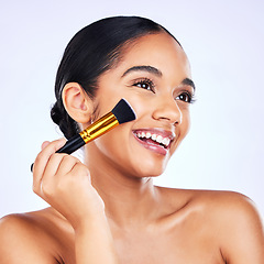 Image showing Beauty, makeup brush and cosmetics of a happy woman in studio for skincare, self care and cosmetology. Skin glow, shine and wellness of a female model with facial application tools for foundation