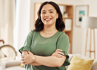 Image showing Portrait, smile and woman in home with arms crossed, relax in good mood and me time in Colombia. Face of happy young female person in living room with confidence, freedom and enjoy break in apartment