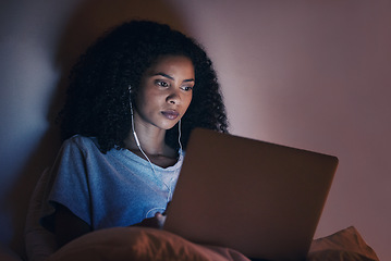 Image showing Laptop, bedroom and woman with music at night for radio, podcast sound and online social media in home. Bed, computer and person with earphones streaming movie, film and video on tech with insomnia