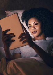 Image showing Woman, tablet and bed with reading in dark room, typing and search for video, chat and social network. African girl, tech and relax in night, home and scroll for thinking, info and choice for movie