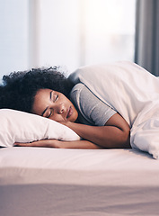 Image showing Sleeping, African woman and bed with morning nap in home with rest feeling calm with peace. House, bedroom and tired female person relax and comfortable on a pillow with blanket dreaming on weekend