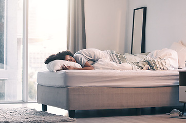 Image showing Sleeping, woman and bed with morning nap and home with rest feeling calm with peace. House, bedroom and tired female person relax and comfortable on a pillow with blanket dreaming over the weekend