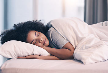 Image showing Sleeping, woman and bed with nap at home in morning with rest feeling calm with peace. House, bedroom and tired female person relax and comfortable on a pillow with blanket dreaming over the weekend