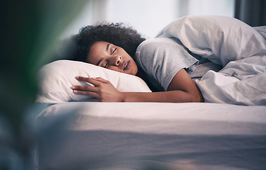 Image showing Sleeping, black woman and bed with morning nap in home with rest feeling calm with peace. House, bedroom and tired female person relax and comfortable on a pillow with blanket dreaming on weekend