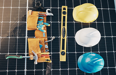 Image showing Solar panel, tools and renewable energy isolated for maintenance and construction work. Above view, sustainability and engineer equipment on a rooftop for eco friendly power project and safety