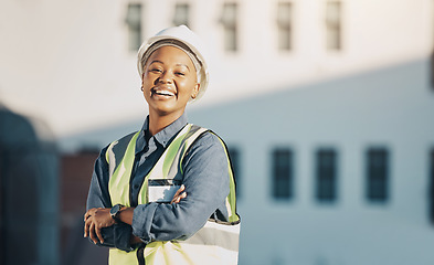 Image showing Woman, construction worker and arms crossed portrait with a smile for engineering and building renovation job. Happy and African female employee on a industrial site outdoor for builder project