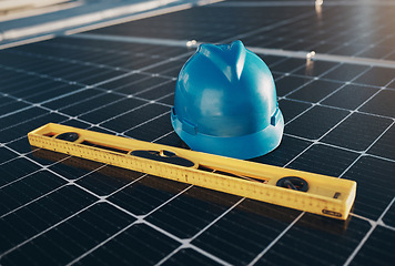 Image showing Solar panel, level tools and helmet for renewable energy isolated for maintenance and construction. industry, sustainability and engineer equipment on a rooftop for eco friendly project and safety