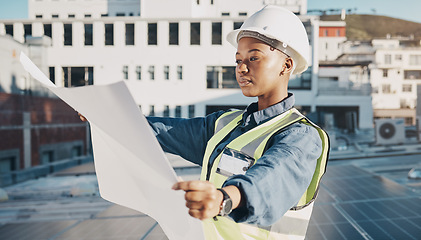 Image showing Female engineer, solar panel blueprint or outdoor on rooftop for power, sustainability plan or energy development. Black woman, photovoltaic tech or reading on roof, analysis or illustration in metro