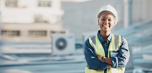 Image showing Woman, construction worker and portrait with a smile for engineering and building renovation job. Arms crossed, happy and African female employee on a industrial site outdoor for builder project