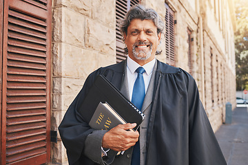 Image showing Portrait, judge or lawyer in city with legal books, constitution or research on policy, rules or knowledge on justice in court. Attorney, man with success or working with expert on government laws