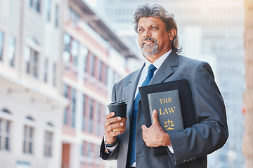 Image showing Lawyer, man with a book and thinking in the city with idea on law, policy or research with legal books and knowledge of rules. Attorney, judge or man with advice in court or working in justice