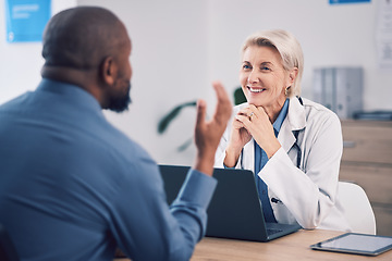 Image showing Doctor, people and office consultation, talking and healthcare services, clinic support and advice with laptop. Medical professional, mature woman and patient consulting for insurance or information