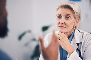 Image showing Face of woman, doctor and listening in consultation for healthcare advice, clinic support or help. Mature medical professional, focus and consulting patient in hospital for feedback, trust or service