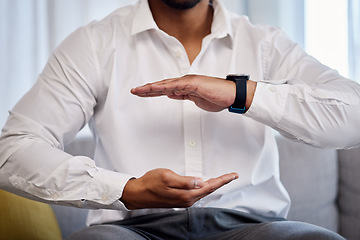 Image showing Hands, mockup and product with a business man sitting on the sofa in an office to offer insurance or cover. Advertising, marketing and size with a male employee holding space for a brand or logo