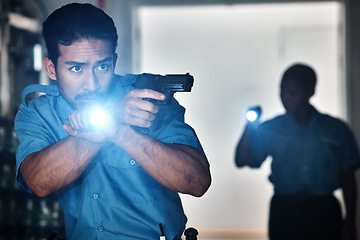 Image showing Torch, police and man with gun for investigation, inspection and property search at night. Surveillance team, flashlight and security male person in dark room for safety, crime and protection service