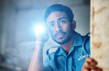 Image showing Flashlight, security guard and man in dark room for investigation, inspection and property search at night. Surveillance, law and police officer with torch for safety, crime and protection service