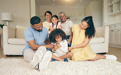 Image showing Happy, family and home with fun and tickle with mother, grandparents and children together. Parent relax, dad love and support with kids on a lounge sofa in a house with a smile in a living room