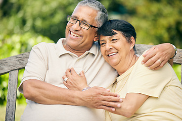 Image showing Happy, love and relax with old couple on park bench for retirement, smile and garden. Happiness, hug and care with senior man and woman on bench in nature for romance, bonding and wellness together