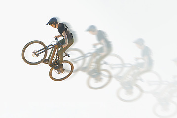 Image showing Bicycle, trick or man riding in the air with speed, motion or overlay of cycling, jump or person training to do a crazy stunt. Cyclist, adrenaline and double exposure of parkour, sports or cycling