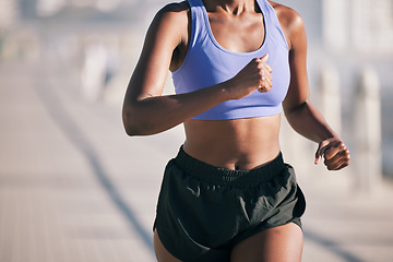 Image showing Closeup, woman and body running outdoor in sun for marathon race, sports performance and fitness. Female runner, cardio training and healthy summer workout for energy, fast action and urban exercise