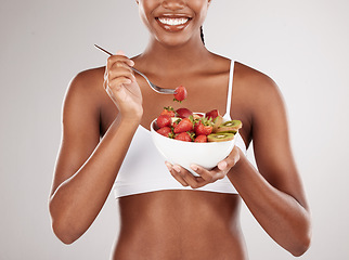 Image showing Woman, hands and diet with fruit salad for natural nutrition against a white studio background. Closeup of female person holding bowl of organic strawberry and kiwi to lose weight or healthy wellness