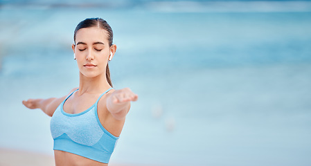 Image showing Fitness, music and woman by beach for yoga with mockup space for wellness, healthy body and energy. Sports, nature and female person listen to audio or song for exercise, training and workout by sea