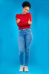 Image showing Fashion, smile and portrait of a woman with comfort and confident isolated in a studio blue background. Casual, calm and full body of a happy young female person with stylish or trendy clothes